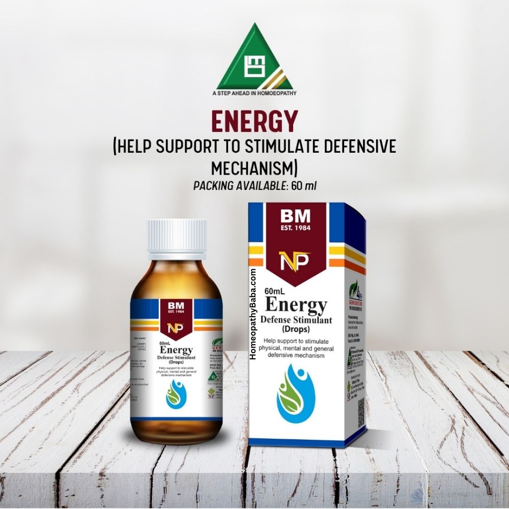 Bottle and box of BM NP Energy drops on a wooden surface with a white background