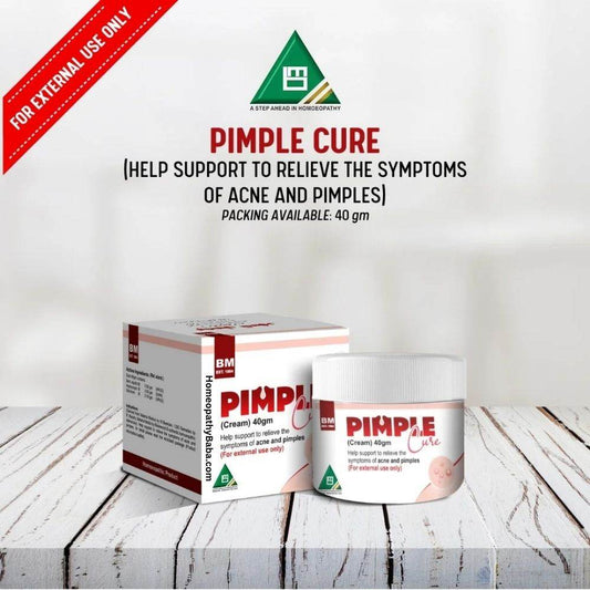Pimple Cure packaging on a wooden surface with a white background

